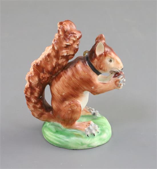 A Derby porcelain figure of a red squirrel, c.1800-30, H. 8.7cm, restoration to ears